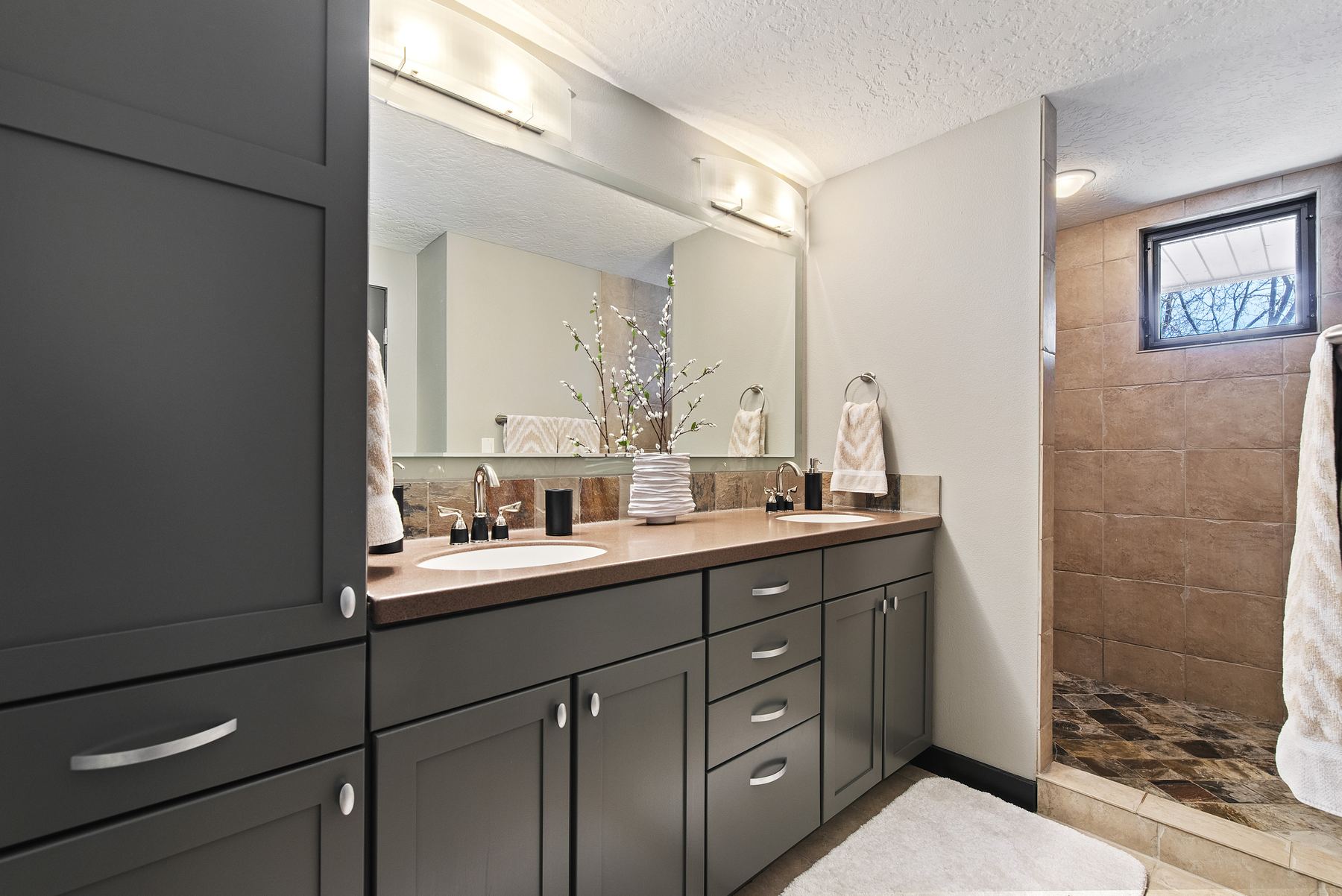 Primary bathroom with double vanity and walk-in tiled shower, Boise vacation rental