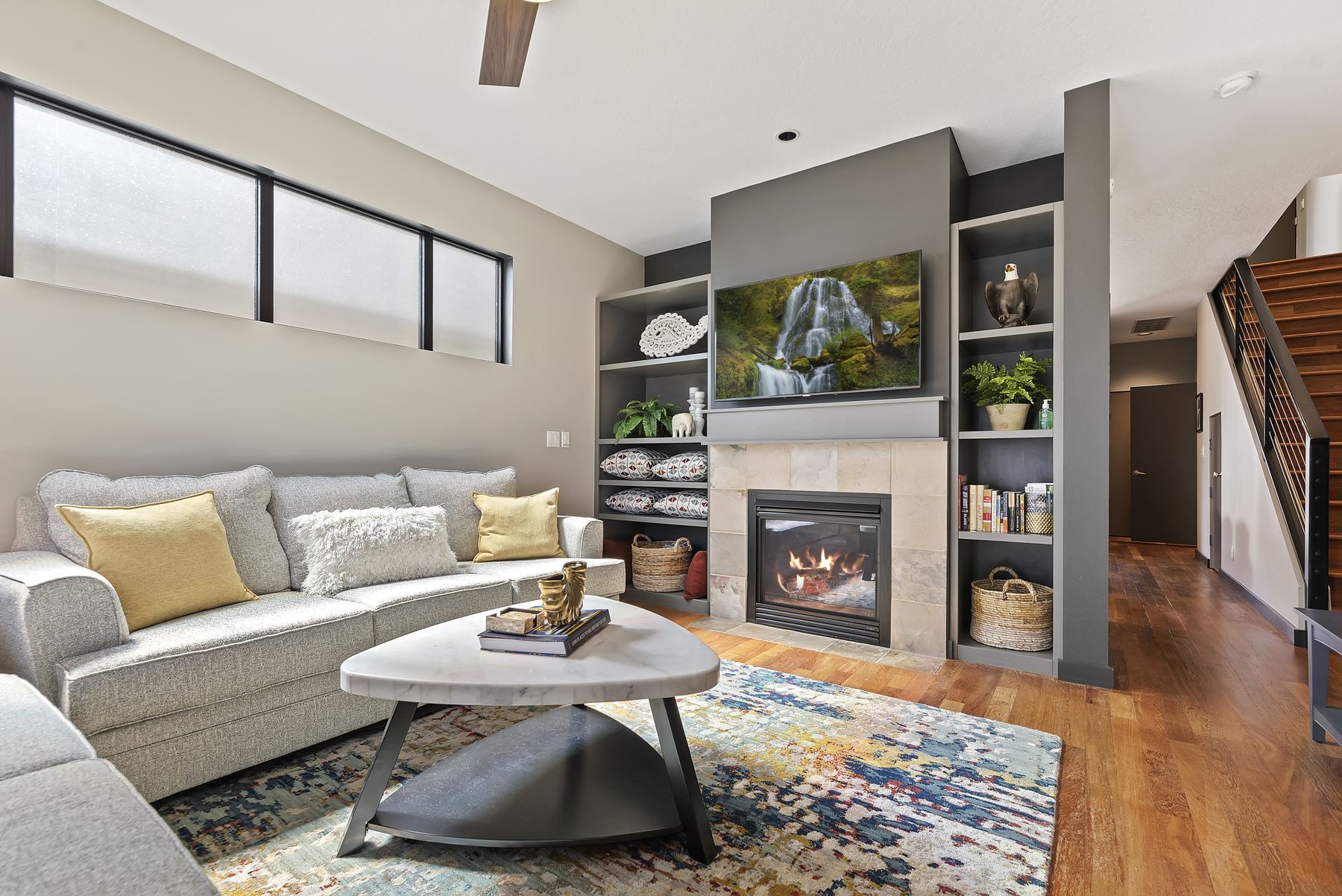 Open-plan living room with gas fireplace at a Boise North End vacation rental